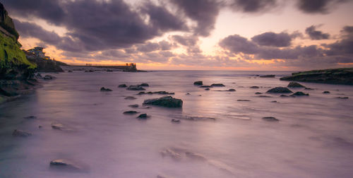 Scenic view of sea against sky at sunset