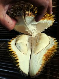 Close-up of hand holding ice cream