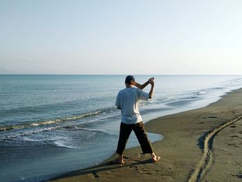 Playing boomerang at the beach