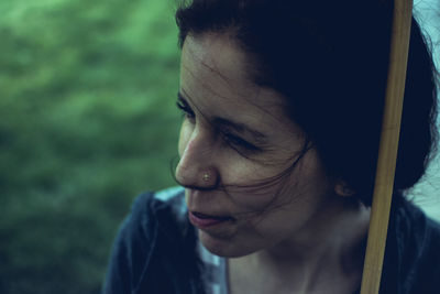 Close-up portrait of woman looking away