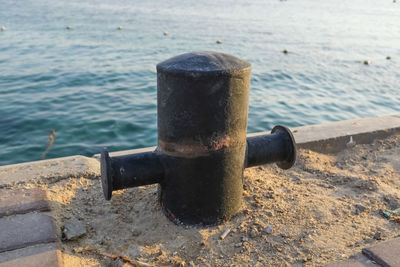 Close-up of rusty metal on beach