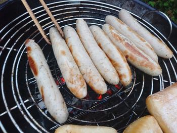 High angle view of meat on barbecue grill