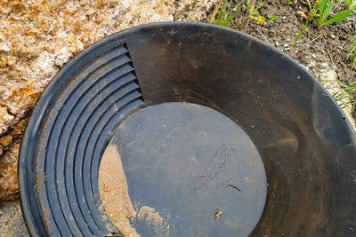 High angle view of manhole on field