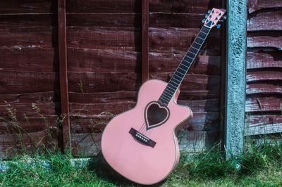 Close-up of guitar on wall