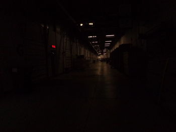 Illuminated tunnel at night