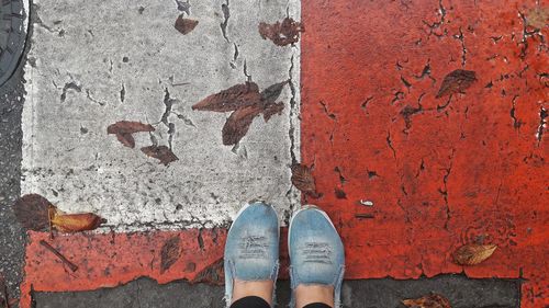 Low section of man standing on floor