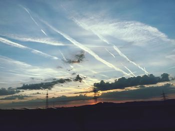 Low angle view of vapor trails in sky