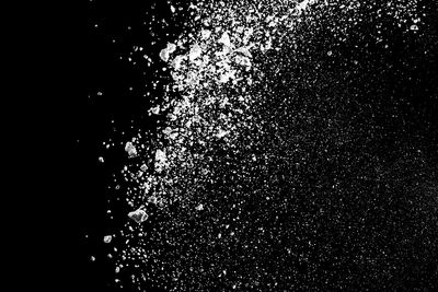 Close-up of splashing water against black background