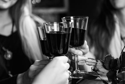 Close-up of hand holding wine glass