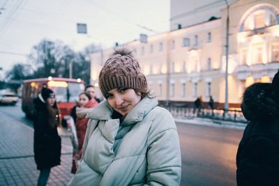 Portrait of people in city street during winter