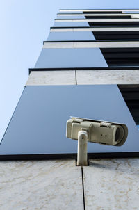 Close-up of built structure against blue sky