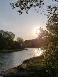 Scenic view of lake against sky during sunset