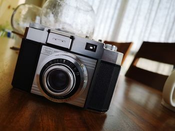 Close-up of camera on table