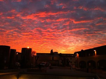Silhouette of built structure against dramatic sky