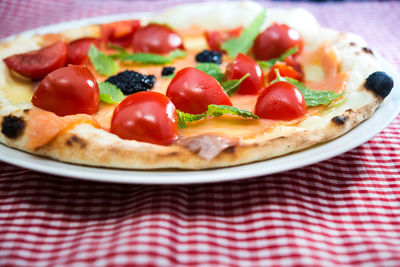 Close-up of pizza served on table