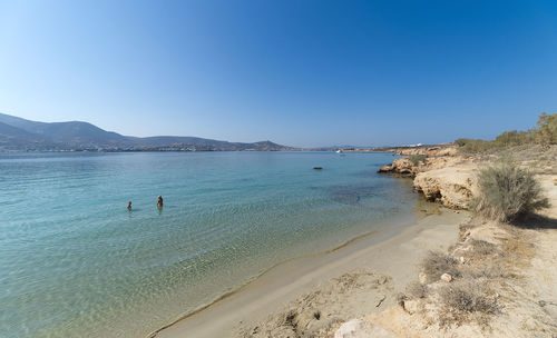 Scenic view of sea against clear blue sky