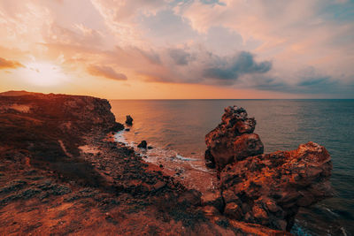 Scenic view of sea against sky during sunset