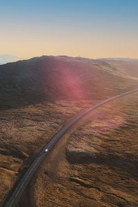 High angle view over scenic road in iceland with one car on the road