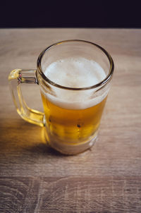 Close-up of beer glass on table