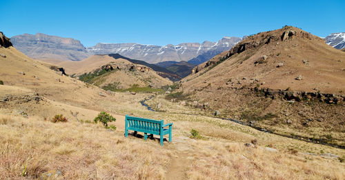 Scenic view of mountains against clear blue sky