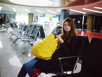 Portrait of woman sitting on chair