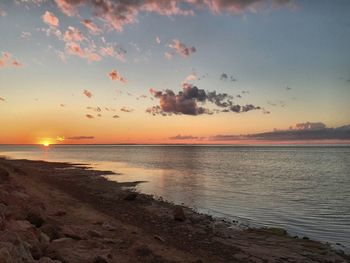 Scenic view of sea against sky at sunset