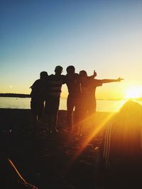 Silhouette people on beach