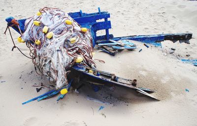 High angle view of fishing net on beach