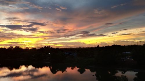 Scenic view of lake against romantic sky at sunset