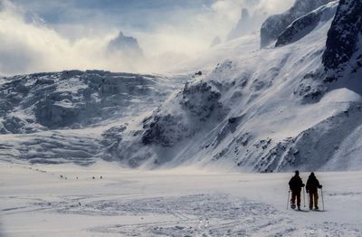 Mountaineers on winter hike in mountains