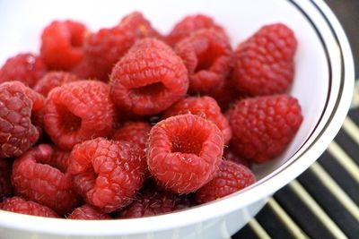 Close-up of raspberries in bowl on table