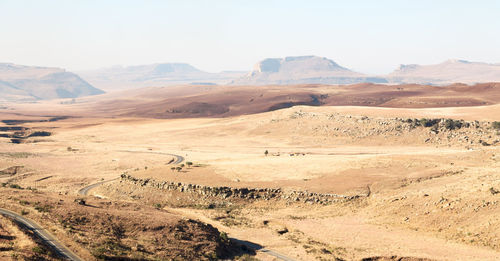 Scenic view of desert against clear sky