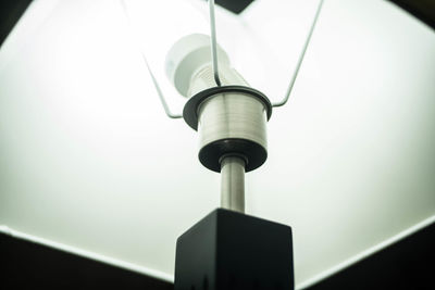 Low angle view of illuminated electric lamp