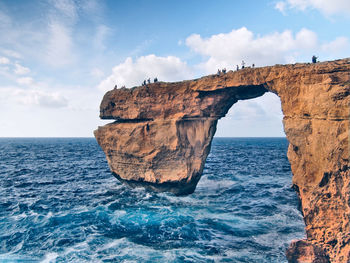 Scenic view of sea against cloudy sky