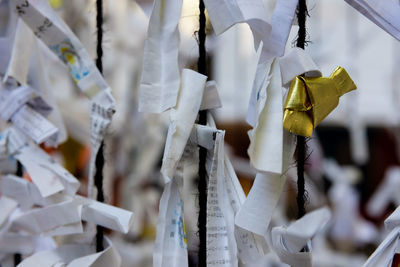 Close-up of clothespins hanging on clothesline