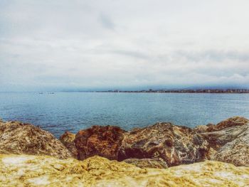 Scenic view of sea against cloudy sky