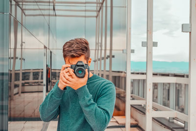 Portrait of man photographing