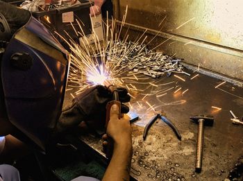 Close-up of man working at workshop