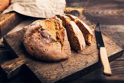 High angle view of bread on cutting board