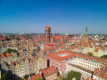 High angle shot of townscape against clear blue sky