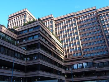 Low angle view of modern building against clear sky