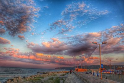 Empty road along calm sea