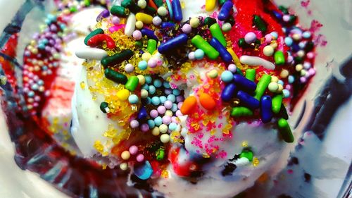 High angle view of multi colored candies in plate