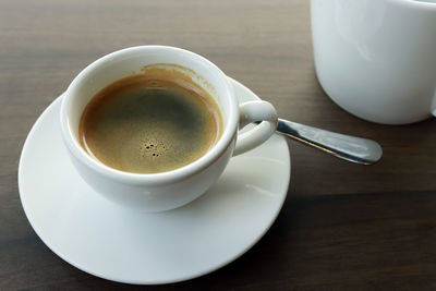 High angle view of coffee cup on table