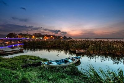 Boats moored in lake