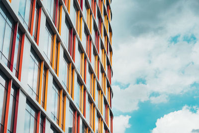 Low angle view of building against cloudy sky