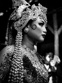 Side view of woman in traditional clothing