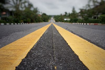 Close-up of yellow road markings