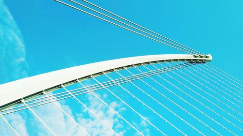 Low angle view of bridge against clear blue sky