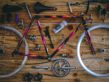 High angle view of bicycle parts on hardwood floor